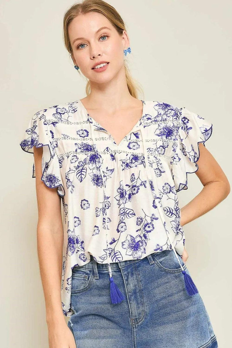 Umgee Full Size Floral Print Tassel Tie Neck Scalloped Sleeve Blouse Plus Size - Brittney MADE